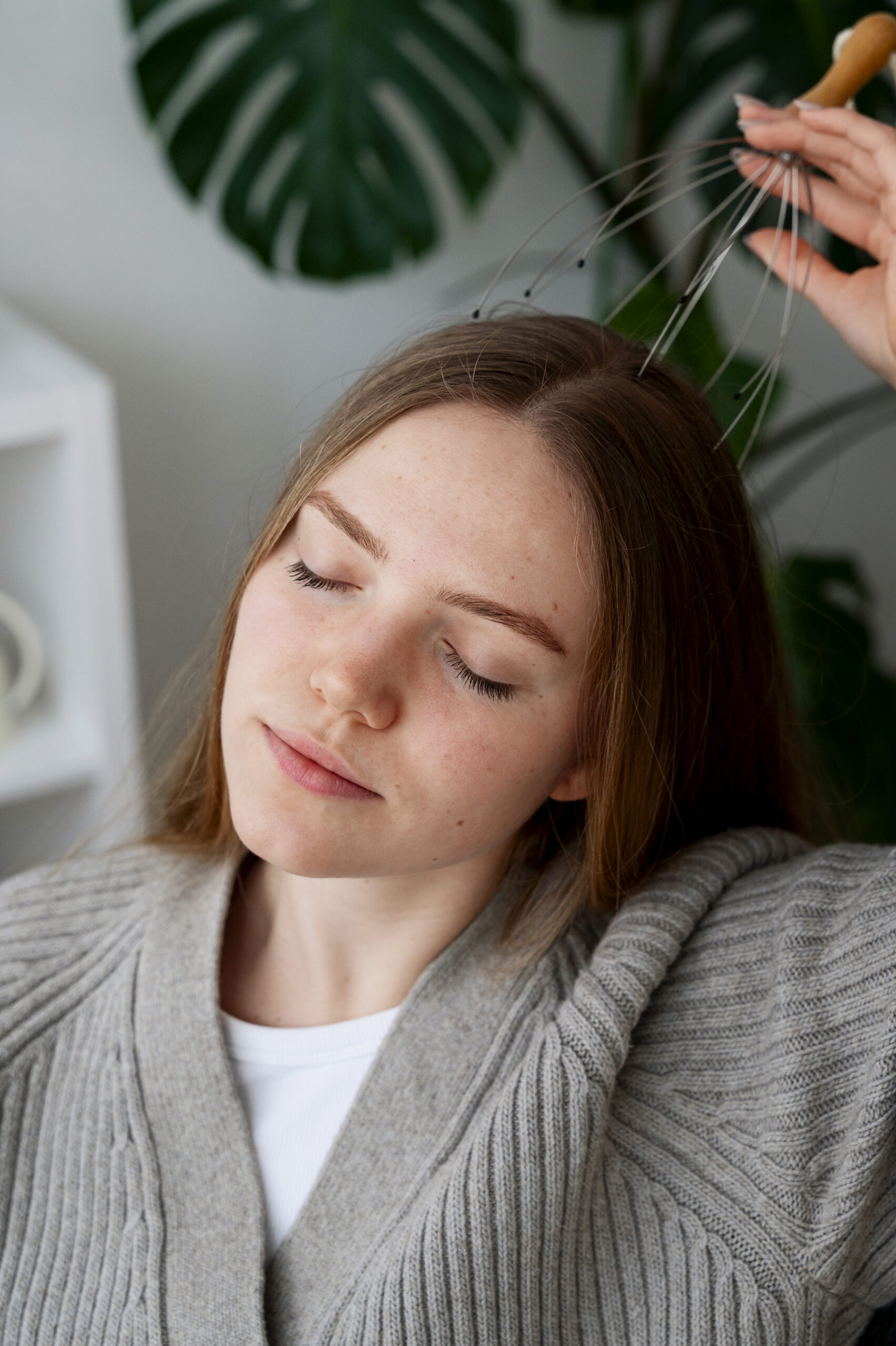 woman-giving-herself-scalp-massage